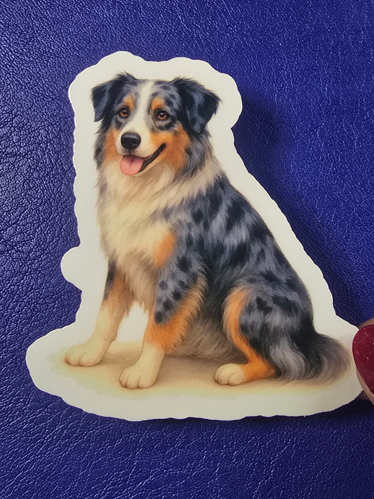 Blue notebook with a dog sticker on top