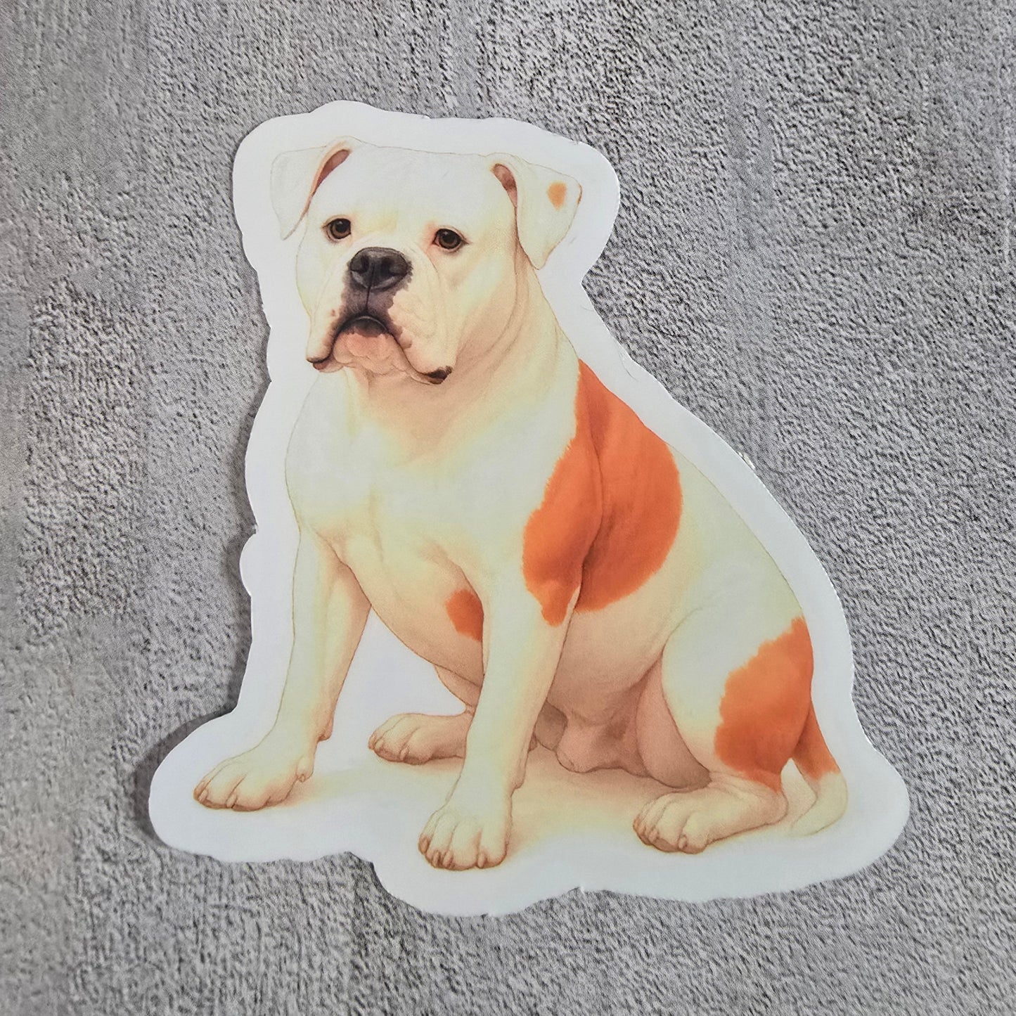 Sticker of a dog lying down on a textured gray surface