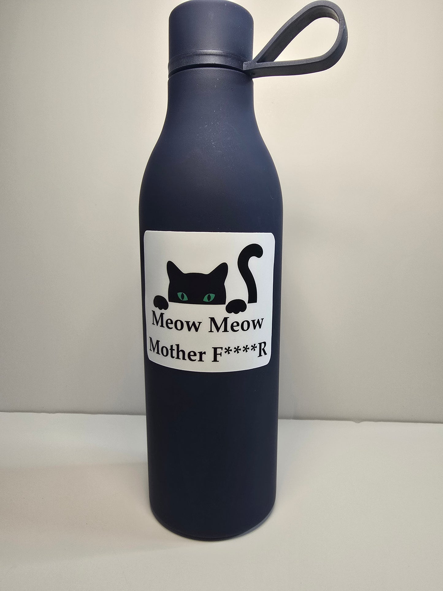 Black water bottle with a humorous label on a white background