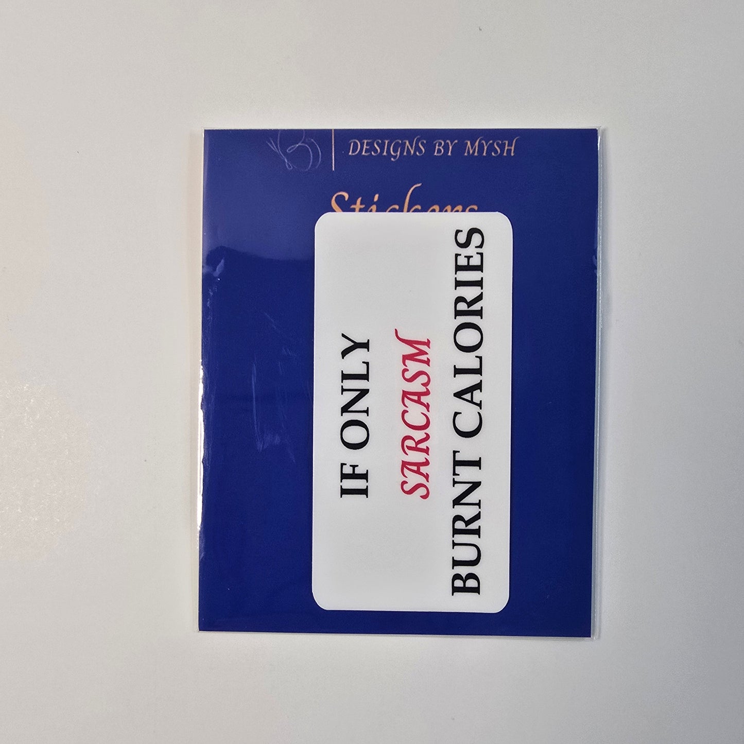 Vinyl sticker with text “If Only Sarcasm Burnt Calories” in black and red, displayed on branded card.