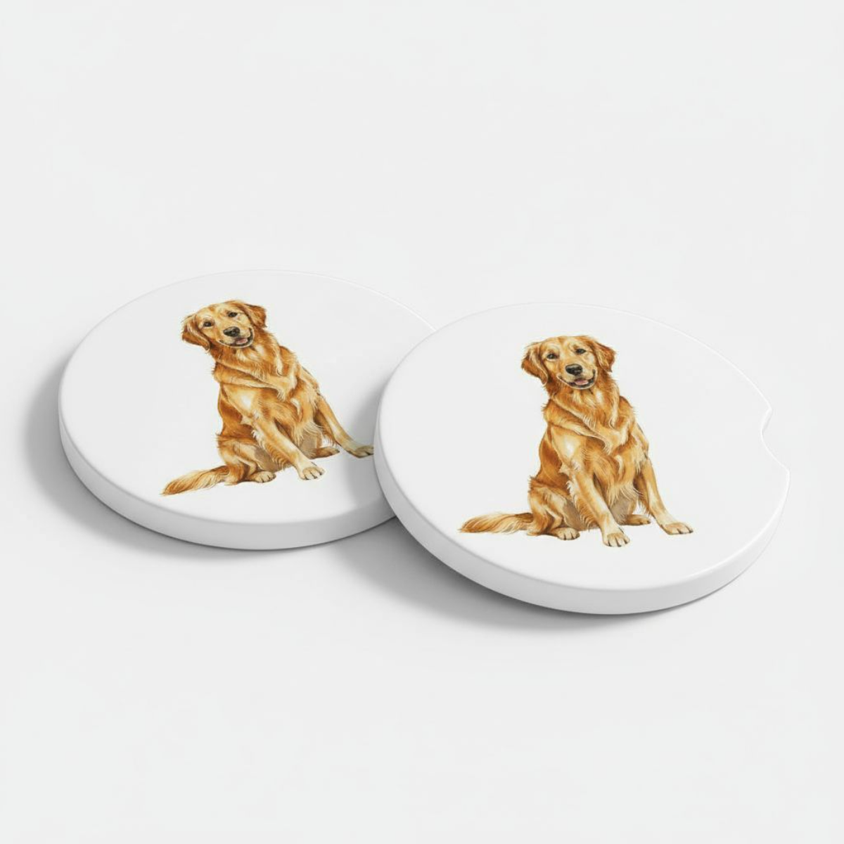 Set of two ceramic car coasters featuring a realistic golden retriever illustration on a white background, designed to fit most car cup holders.