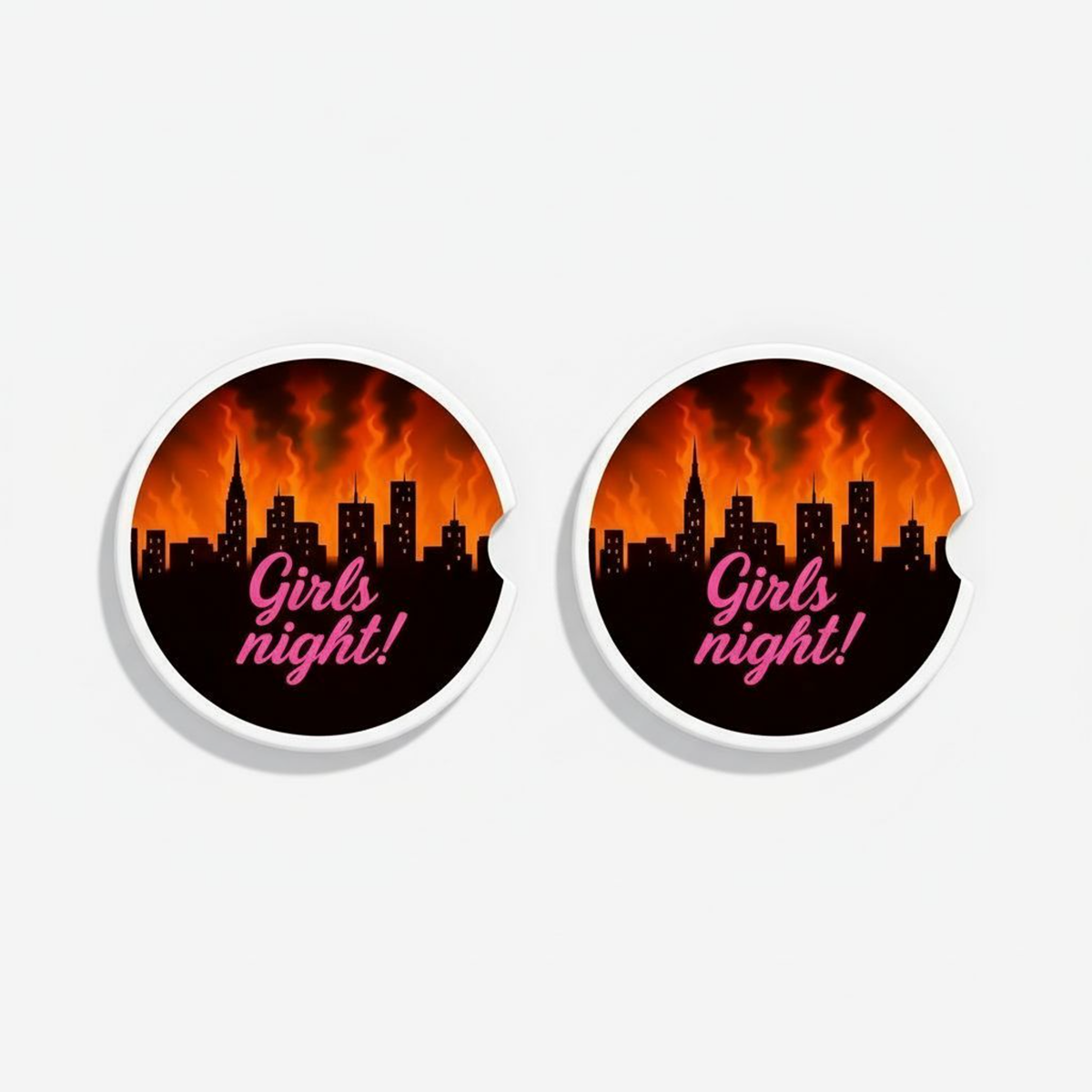Set of two ceramic car coasters with a black city skyline and flames, featuring the text “Girls Night!” in pink script and a side notch for easy removal.