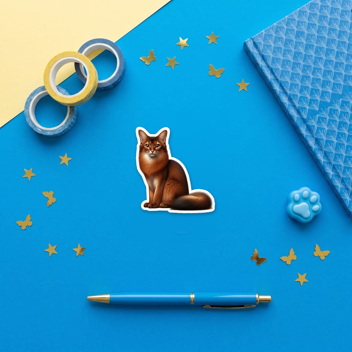 Somali Cat watercolor 3 inch fridge magnet flat lay with blue stationery