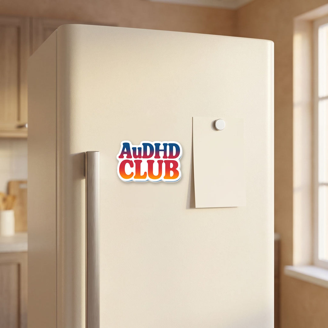 AuDHD CLUB magnet on a refrigerator door