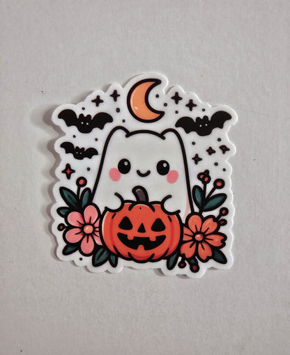 Cute vinyl die-cut Halloween sticker featuring a smiling ghost inside a jack-o’-lantern, surrounded by flowers, bats, stars, and a crescent moon.