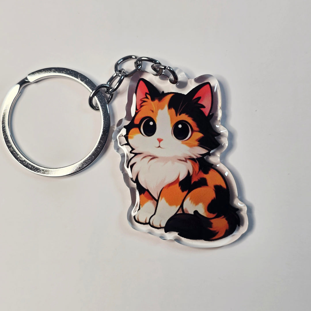 Keychain with a cat design on a light gray background
