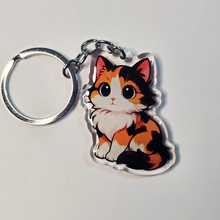 Keychain with a cat design on a light gray background