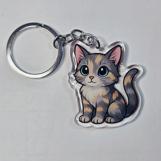 Keychain with a cute cat design on a gray background