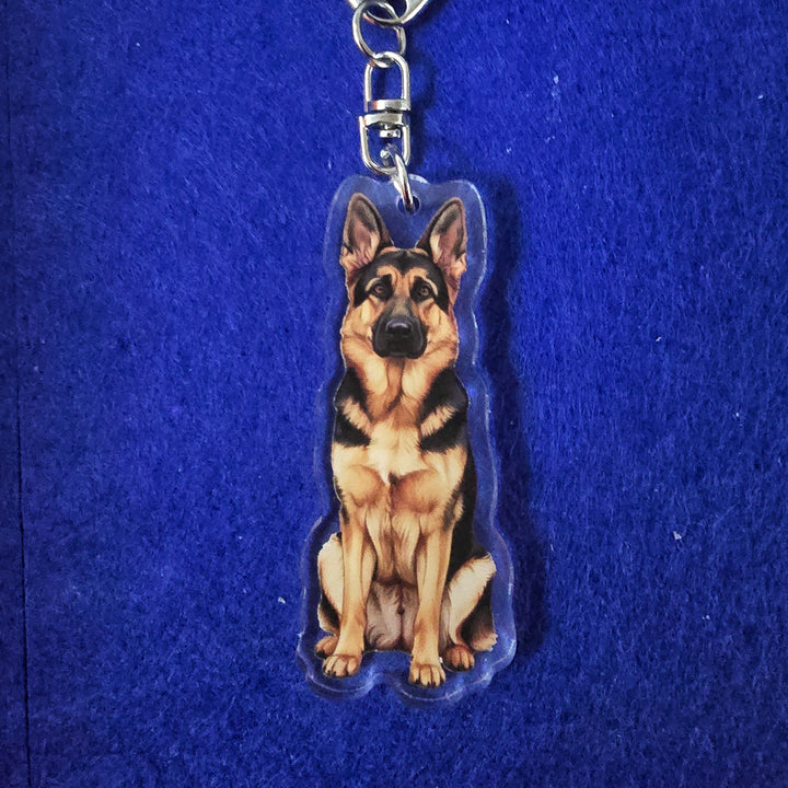 German Shepherd Sable Watercolor Style - Acrylic Keychain on a blue background