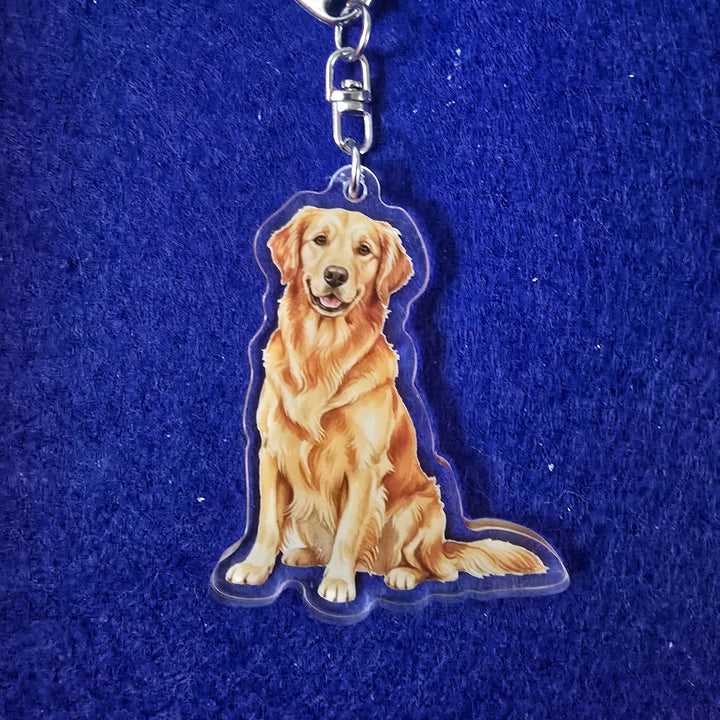 Keychain with a golden retriever design on a blue background