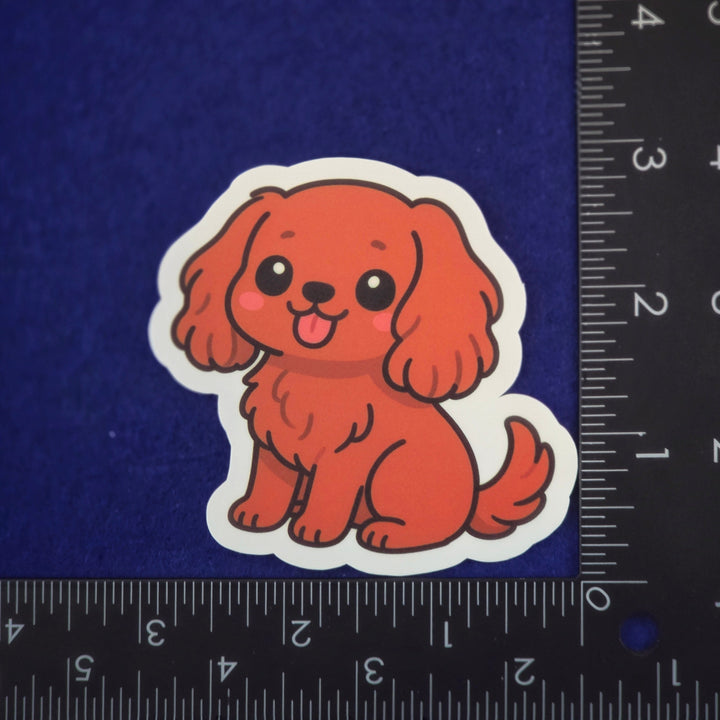 Sticker of a cartoon dog on a blue background with a ruler for scale.