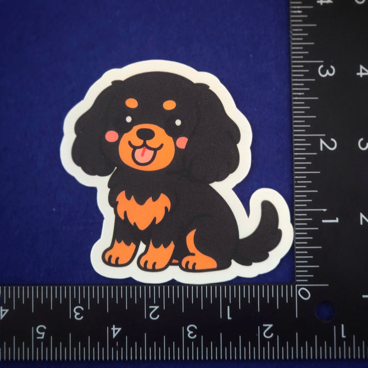 Sticker of a cartoon dog with a ruler for scale on a blue background