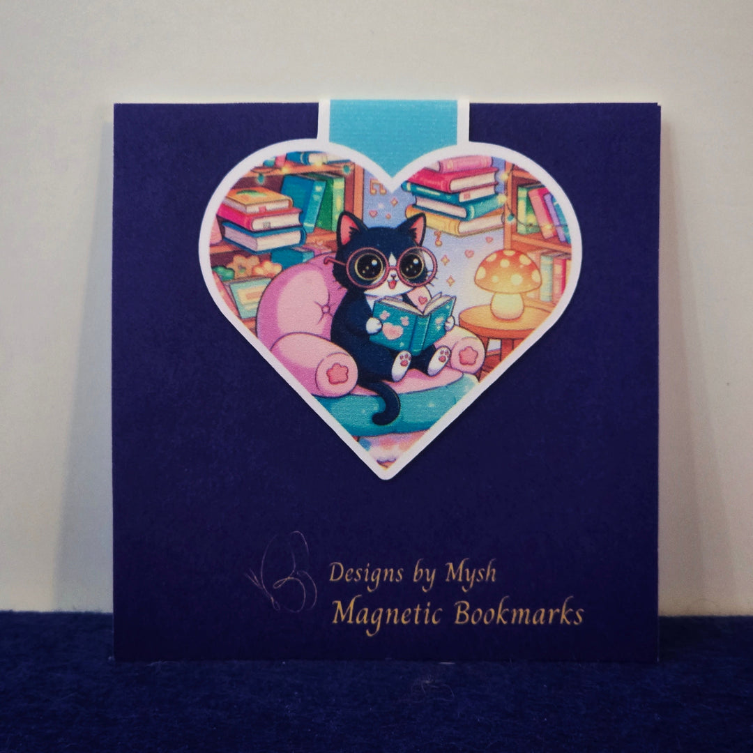 Magnetic bookmarks packaging with a heart-shaped design featuring a cat and books on a blue background.