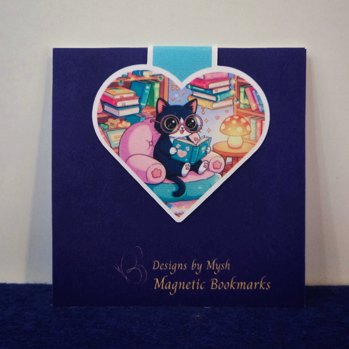 Magnetic bookmarks packaging with a heart-shaped design featuring a cat and books on a blue background.