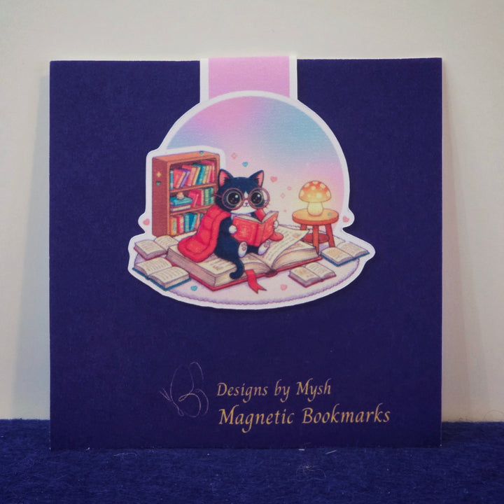 Magnetic bookmarks packaging with a cat illustration on a blue background