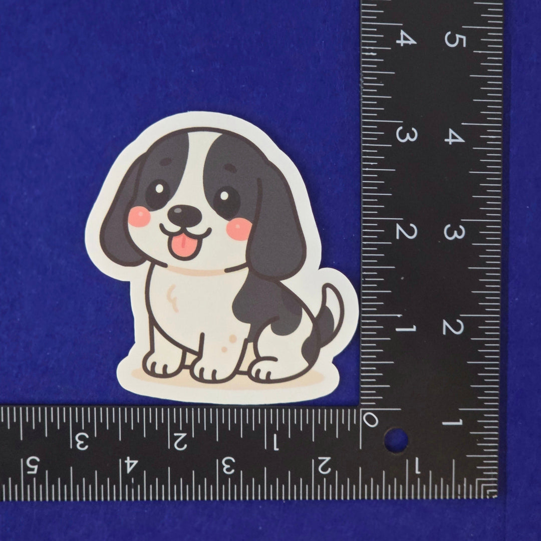 Black and White Basset Hound kawaii style sticker on a blue background.