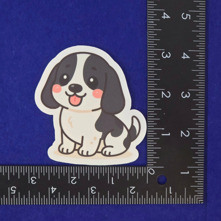 Black and White Basset Hound kawaii style sticker on a blue background.