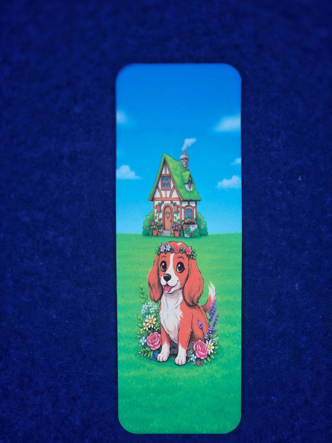 Bookmark with a cartoon dog and house on a blue background