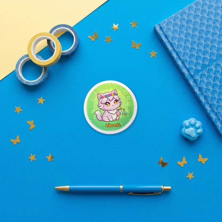 Zodiac Libra Cat 3 inch fridge magnet flat lay with blue stationery