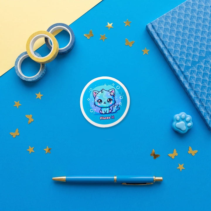 Zodiac Pisces Cat 3 inch fridge magnet flat lay with blue stationery