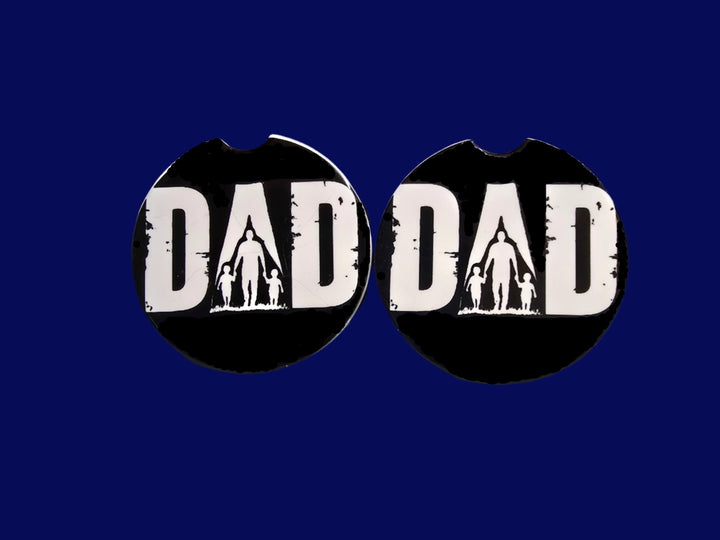 Two black ceramic car coasters with &