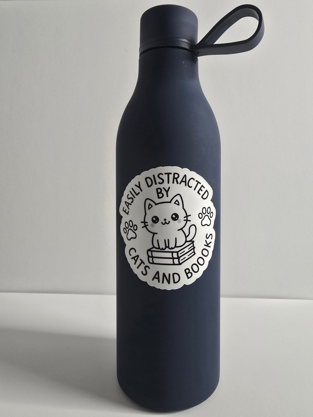 Easily Distracted by Cats and Books Sticker – Bookish Cat Lover Vinyl Sticker (3") - Designs by Mysh