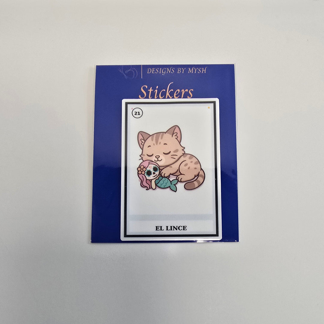 Vinyl sticker depicting a cute lynx cat with yarn and sugar skull in a Lotería card style labeled “El Lince.”