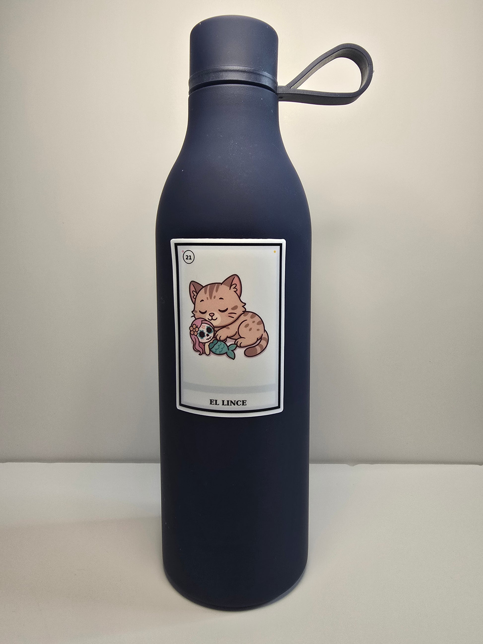 Black water bottle with a label featuring cartoon characters on a light gray background