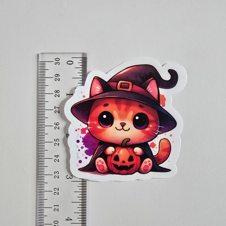 Halloween Witch Cat Sticker – Cute Orange Kitty with Pumpkin | 3-Inch Vinyl Die Cut - Designs by Mysh