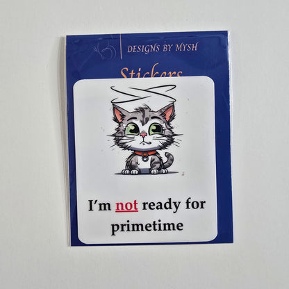 Cartoon sticker of a halo-wearing gray tabby cat with the caption "I'm not ready for primetime."