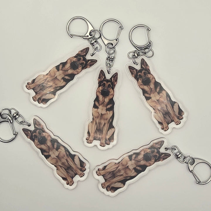German Shepherd dog keychains on a light gray background