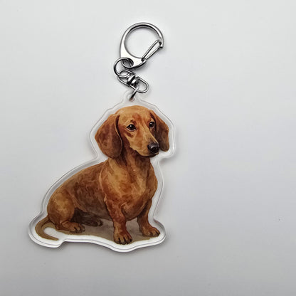 Dog-shaped keychain on a light gray background