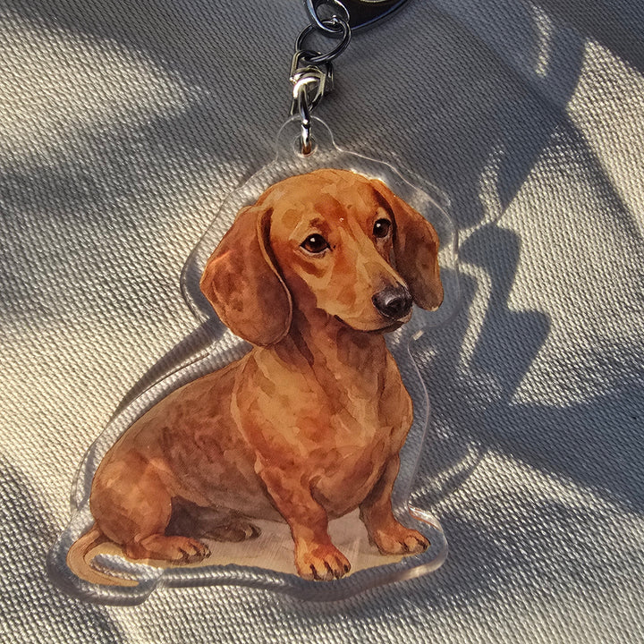 Dog-shaped keychain on a textured surface