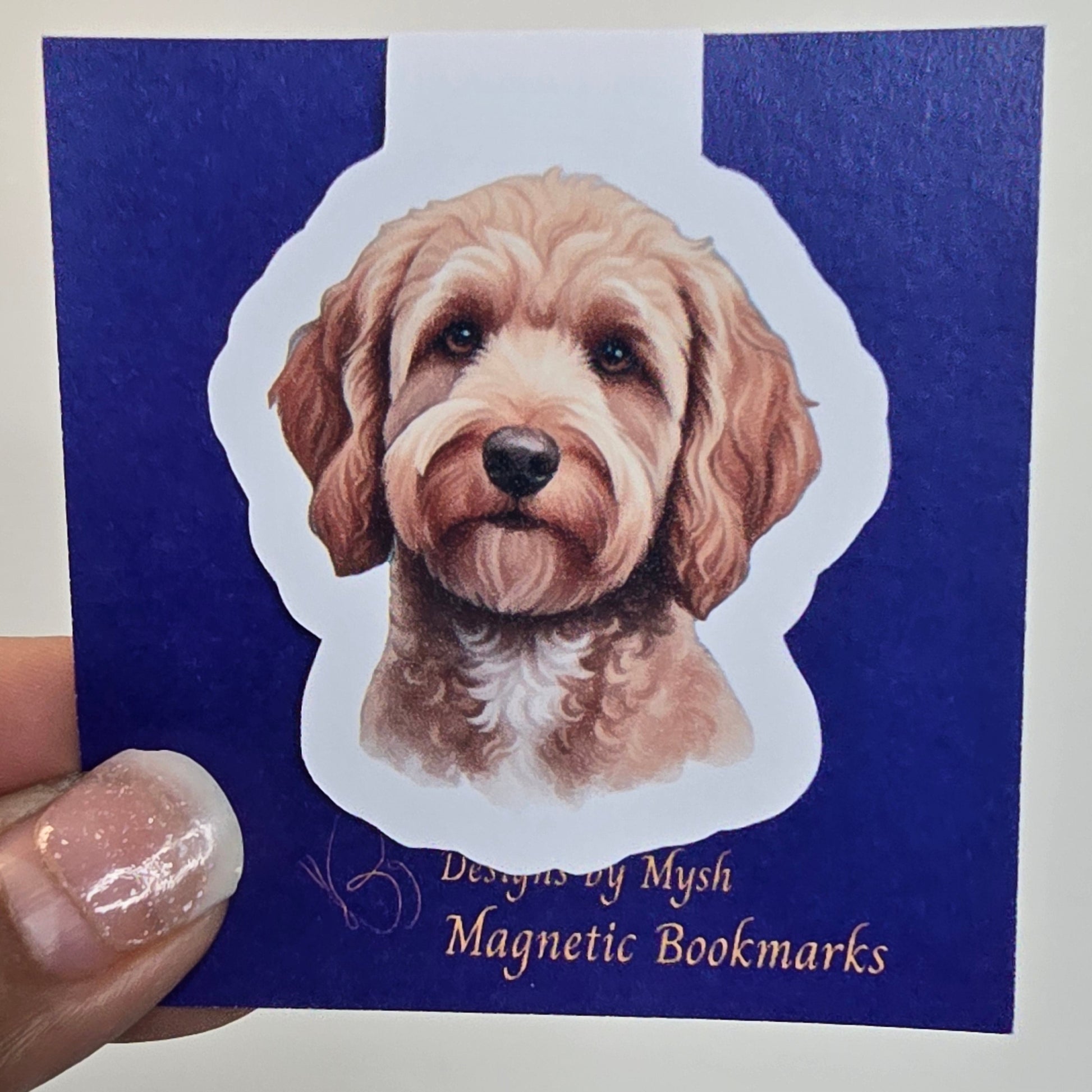 Dog-shaped magnetic bookmark on a blue card with text