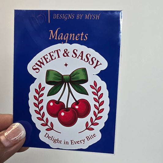 Pack of 'Sweet & Sassy' magnets with a decorative design on a blue background.
