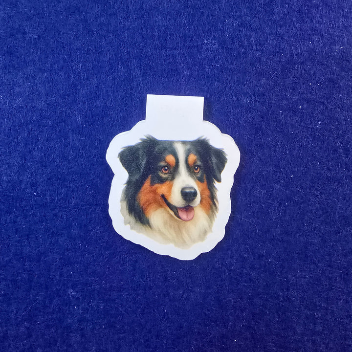 Sticker of a dog's face on a blue background