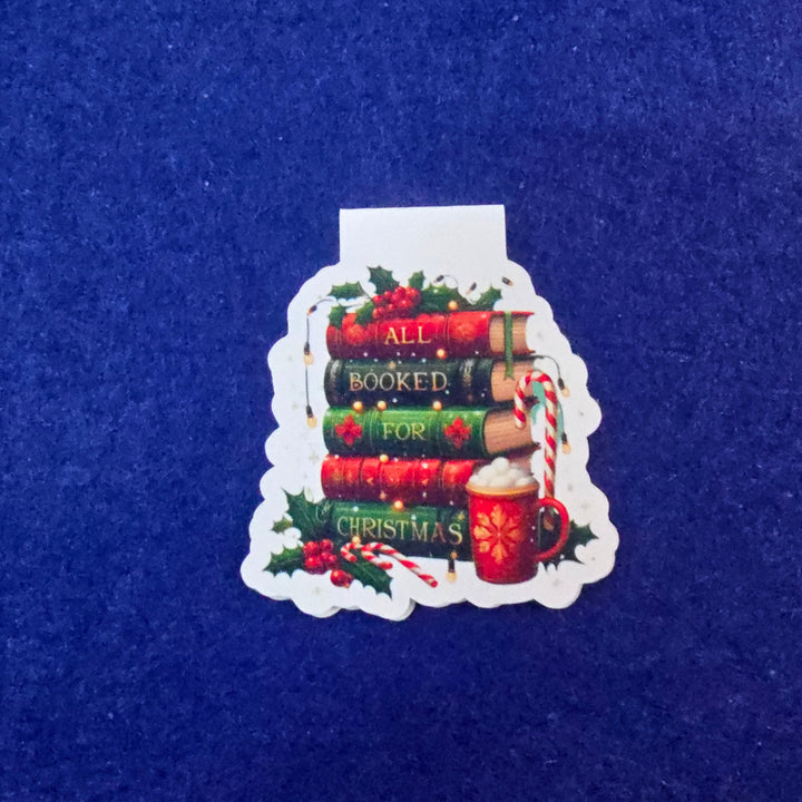 Decorative Christmas book-themed ornament on a blue background