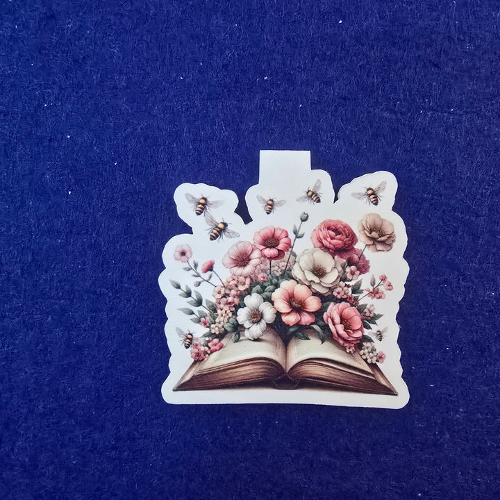 Decorative hair clip with floral design on a blue background