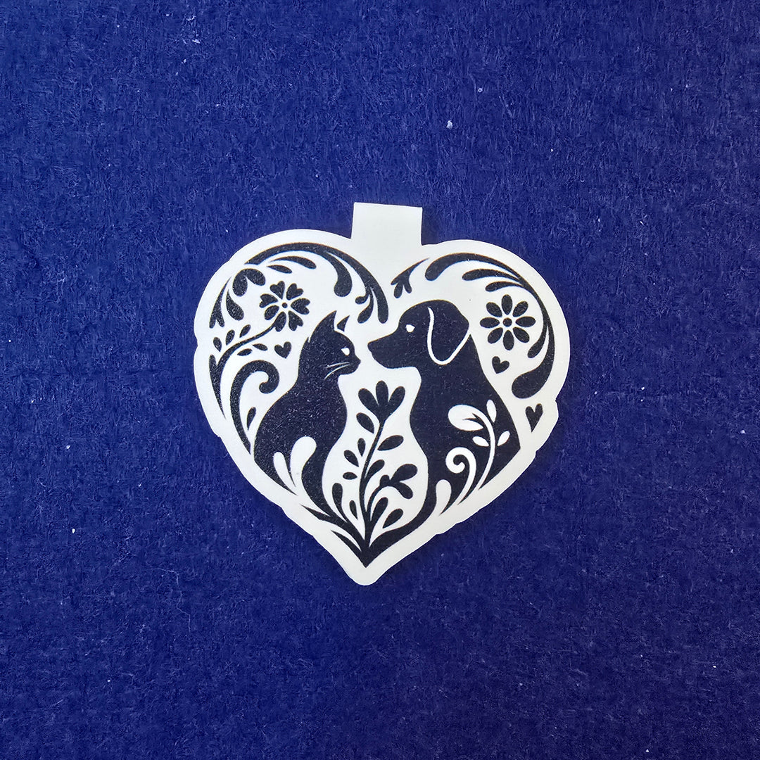 Decorative heart-shaped cutout with floral patterns on a blue background