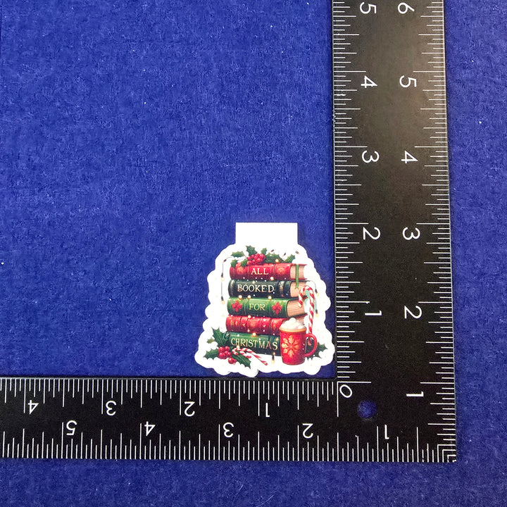 Small decorative item on a blue background with a ruler for scale.