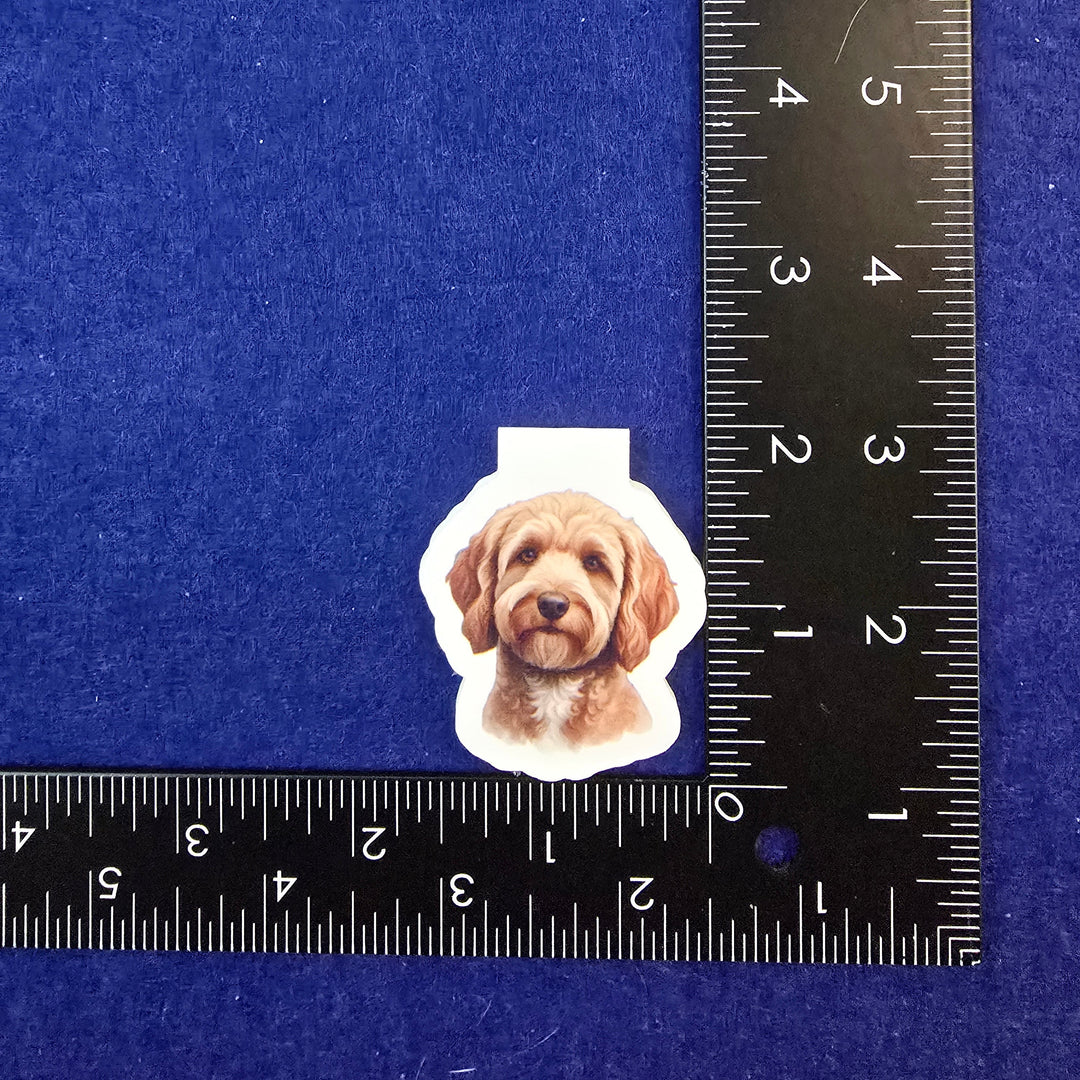 Sticker of a dog's face next to a ruler on a blue background