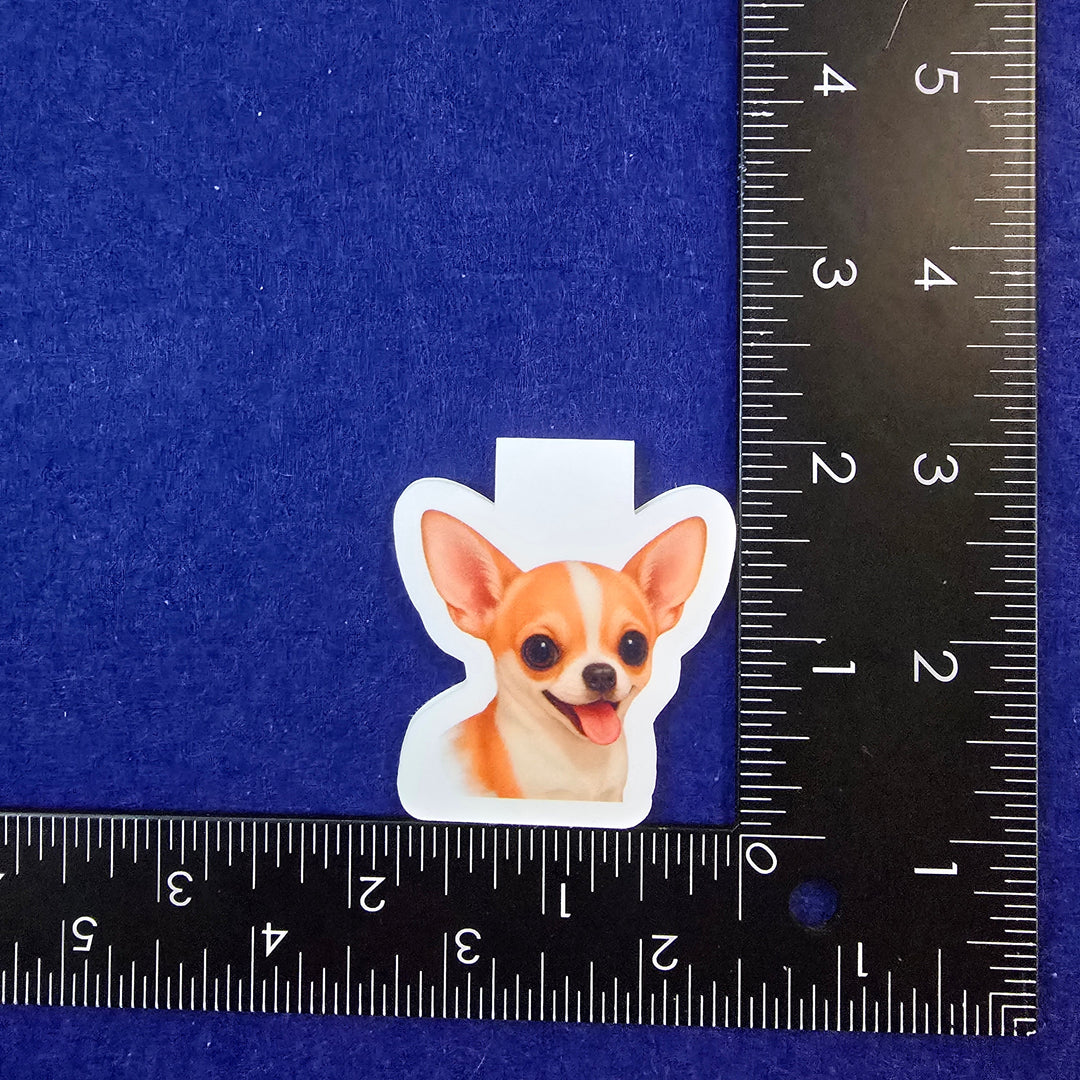 Sticker of a dog on a blue background with a ruler for scale.