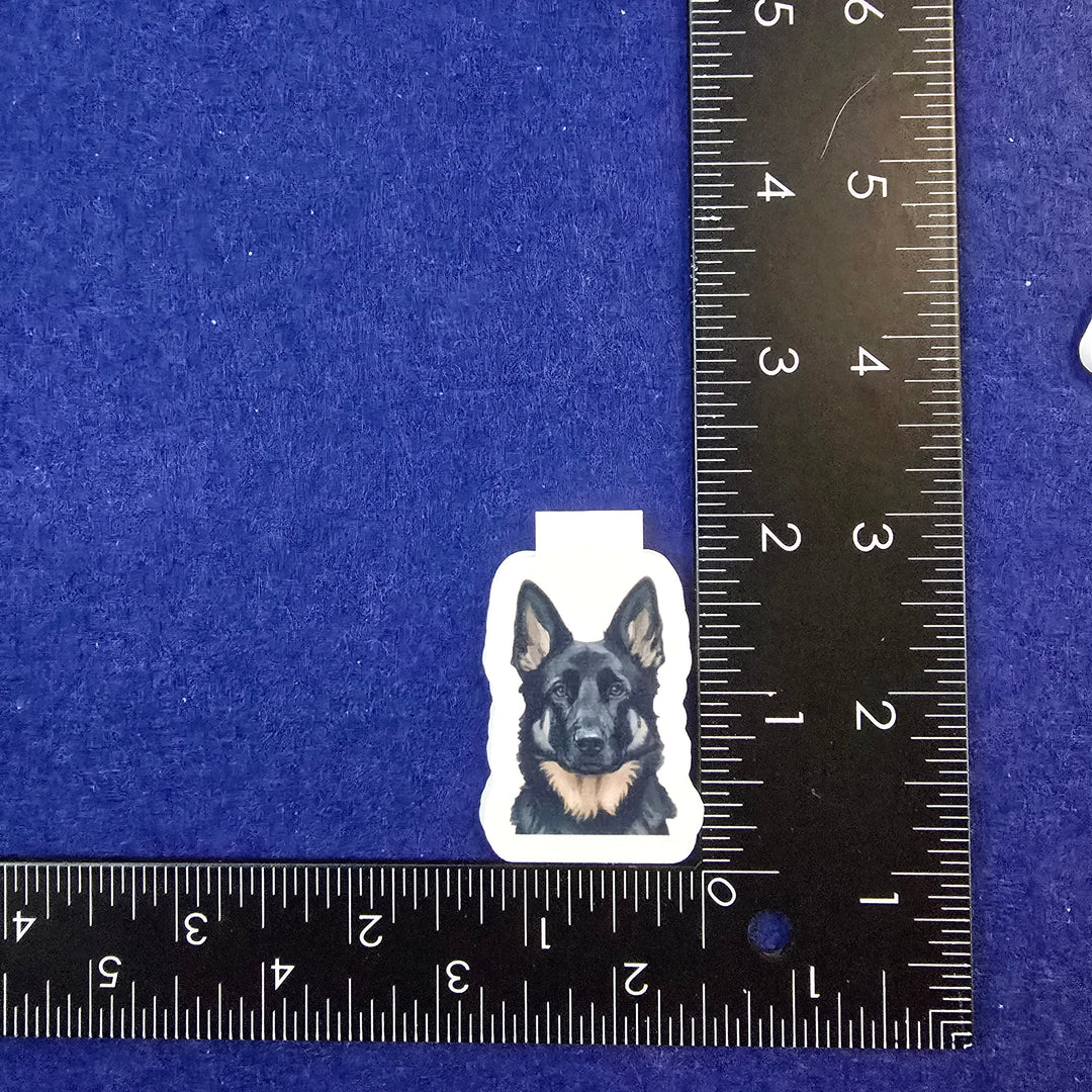 Sticker of a dog on a blue background with a ruler for scale.