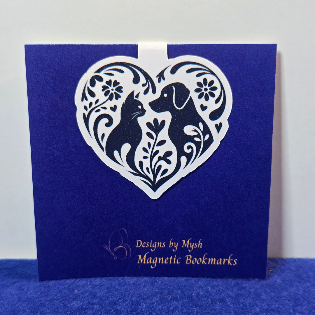 Blue book with white decorative design and text on a white background