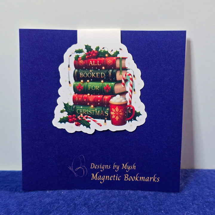 Blue book with a decorative label featuring books and candy canes on a white background