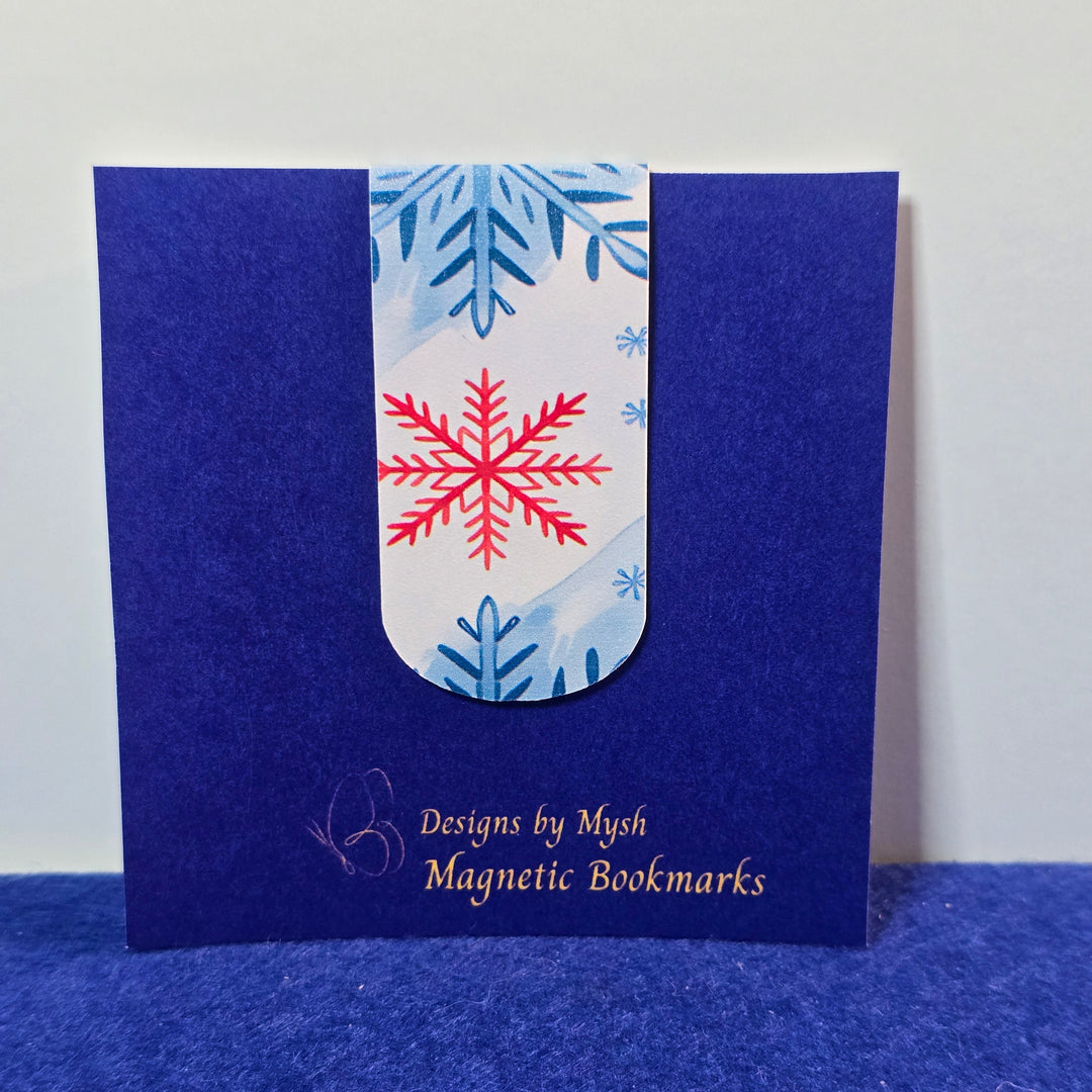 Blue magnetic bookmark with a snowflake design on a white background