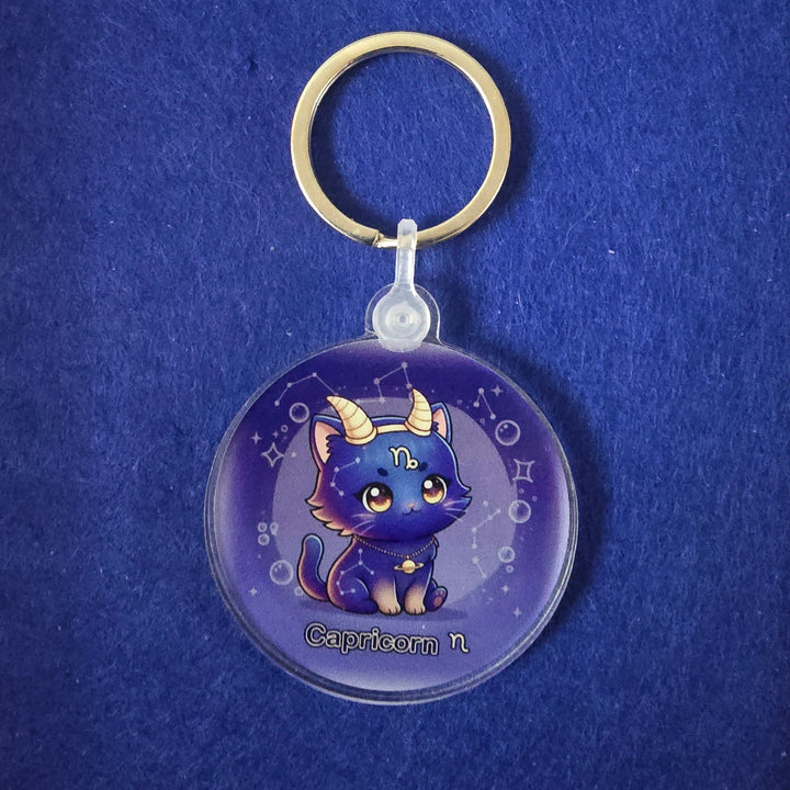 Keychain with a blue creature design on a blue background