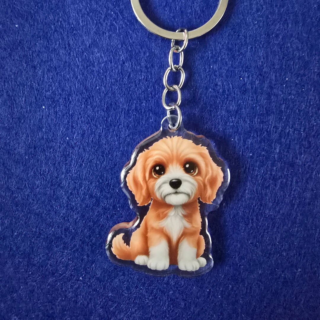 Keychain with a cartoon lion design on a blue background