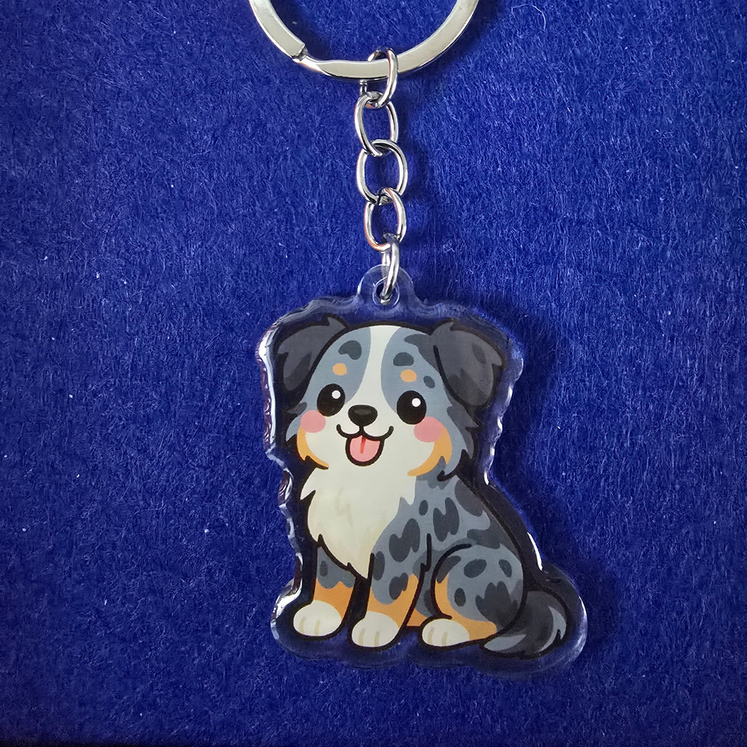 Keychain with a cartoon cat design on a blue background
