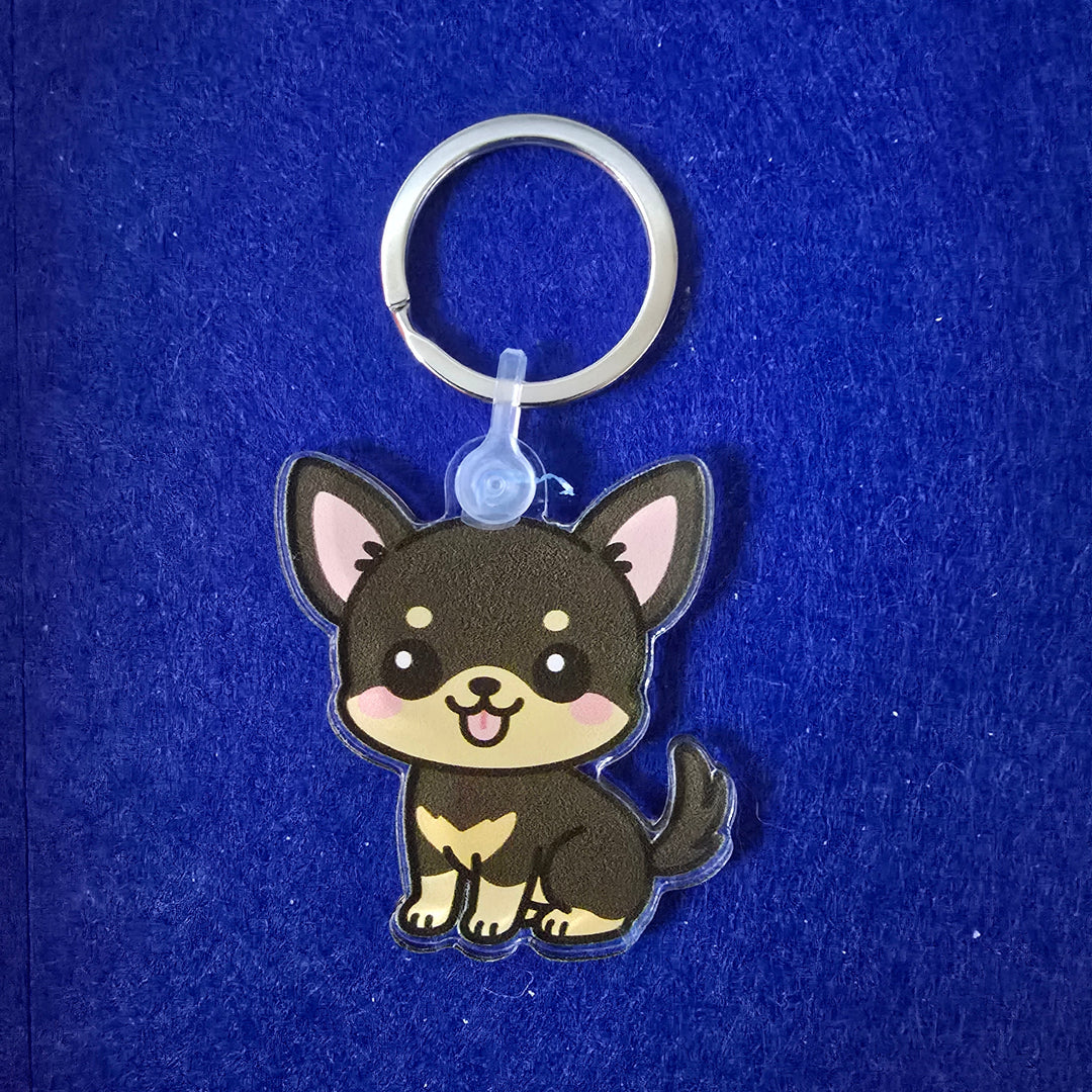 Keychain with a cartoon dog design on a blue background
